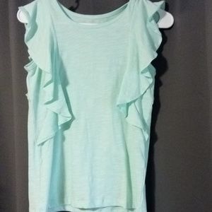 A sea foam colored shirt.